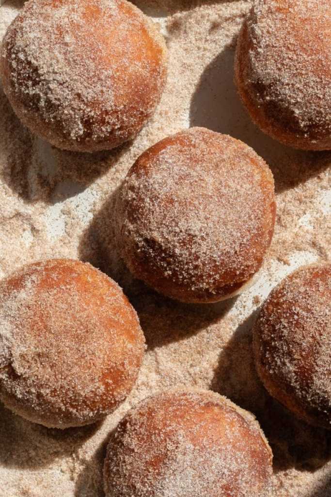 The donuts coated in cinnamon sugar.