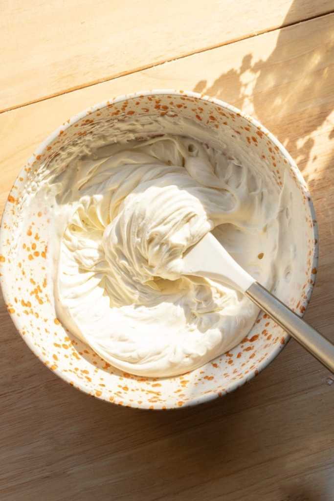 Maple mascarpone cream in a mixing bowl.