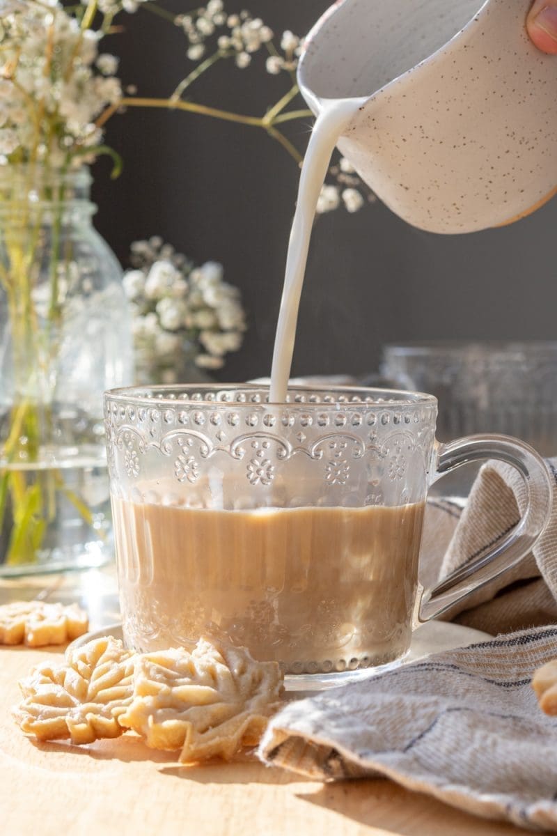 Pouring in the milk.
