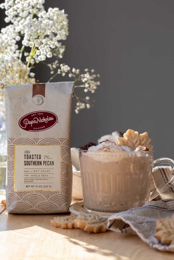 The toasted pecan maple latte next to a bag of coffee.