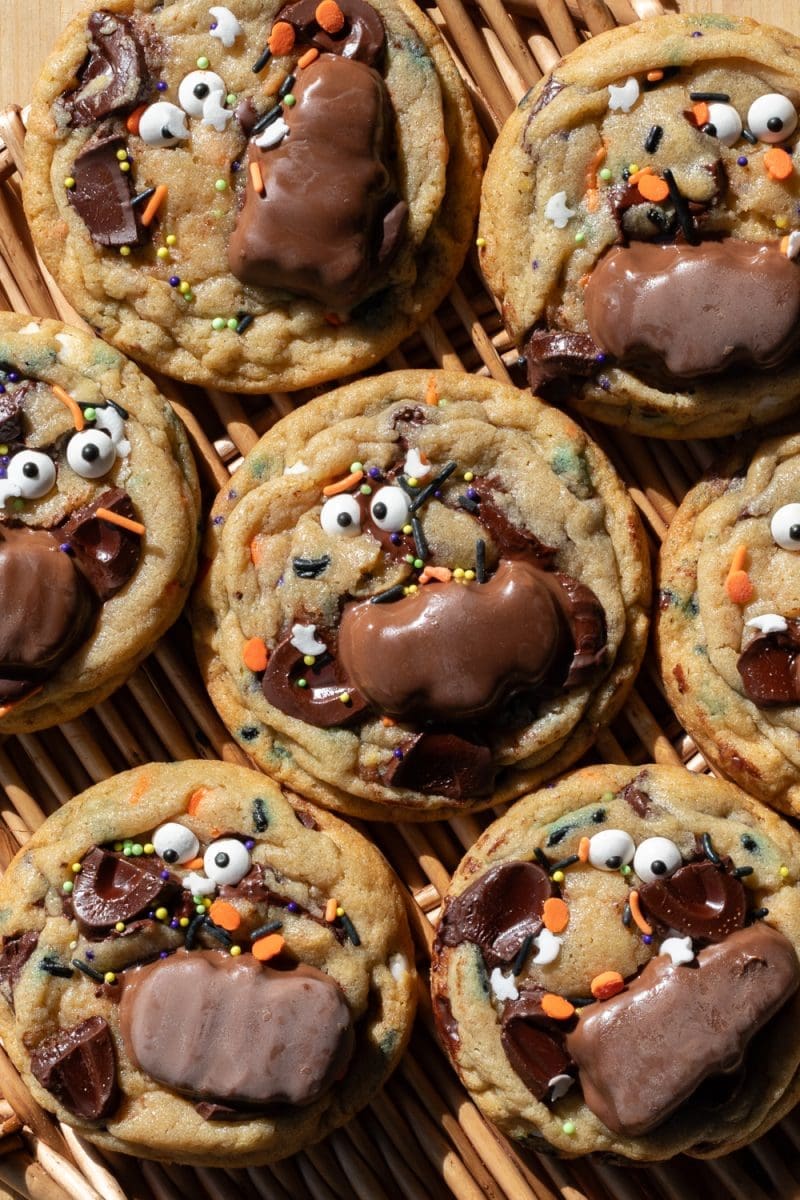 Halloween chocolate chip cookies on a tray surrounding each other.