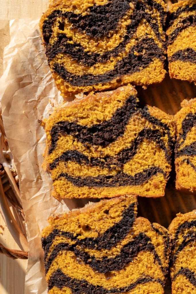 Slices of the chocolate marbled pumpkin bread next to each other.