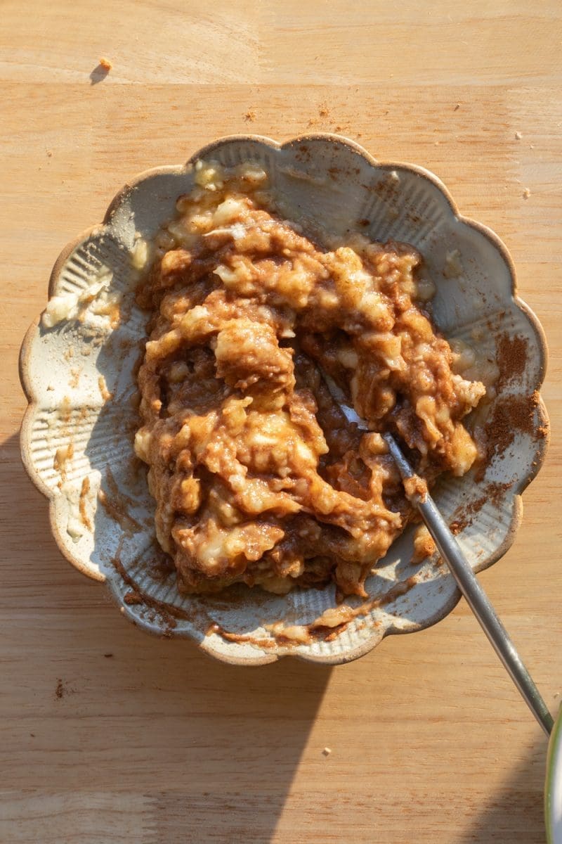 Mashed banana and spices on a plate.