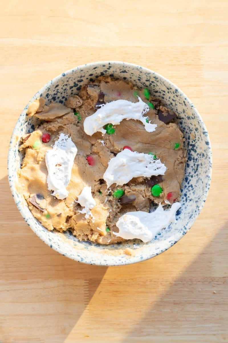 Dollops of marshmallow fluff on top of the cookie dough.
