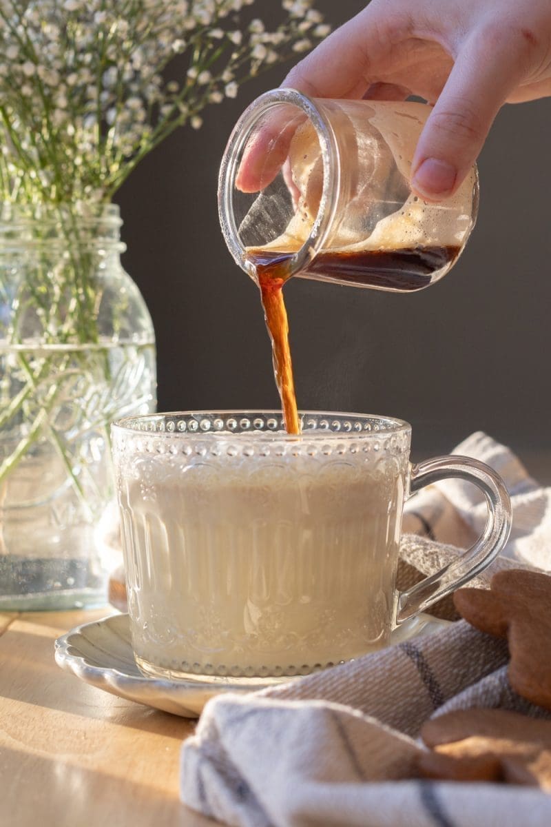 Pouring the espresso into the cup.