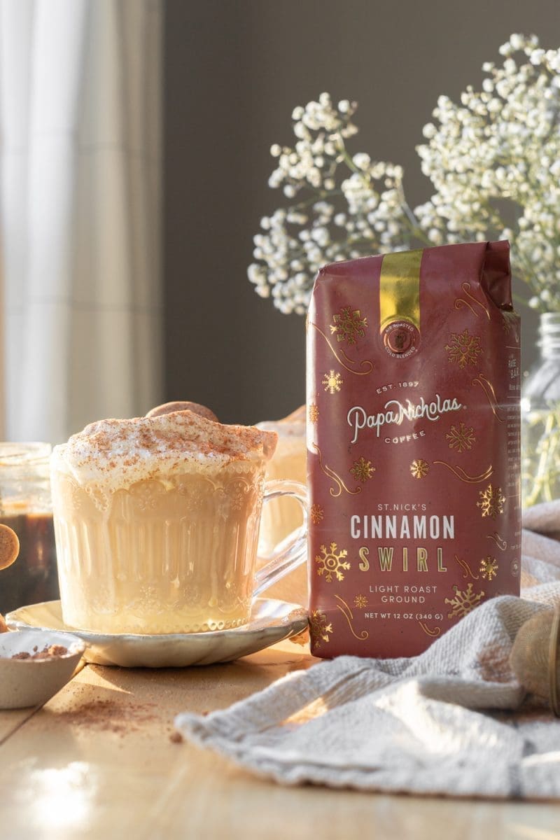 The gingerbread eggnog latte next to a bag of coffee.