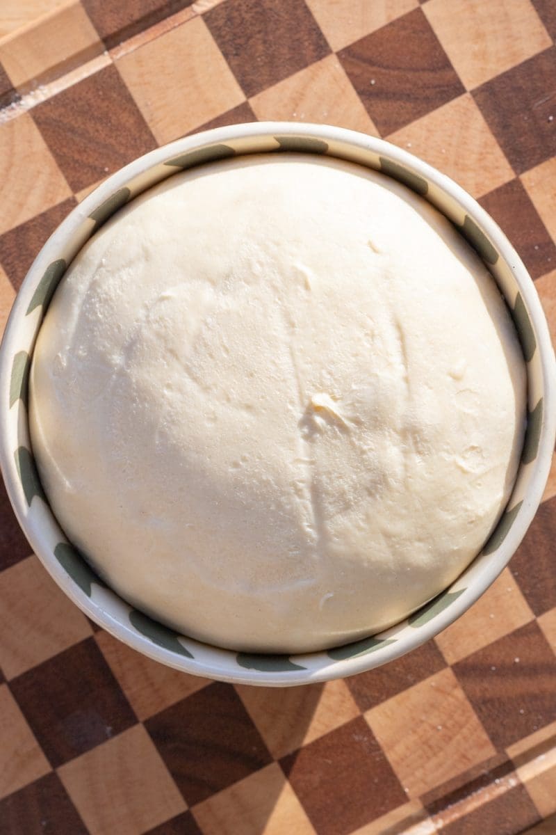 Milk bread dough in a mixing bowl.