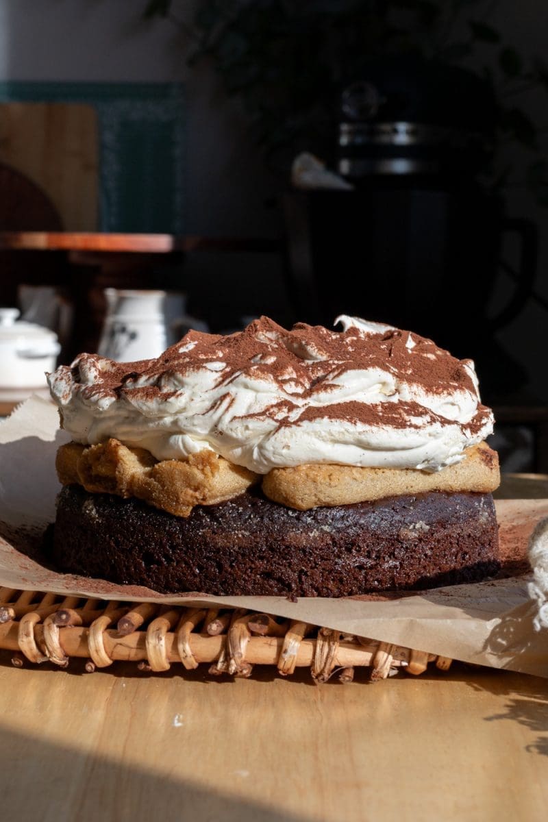 Close up of the whole frosted tiramisu chocolate cake.