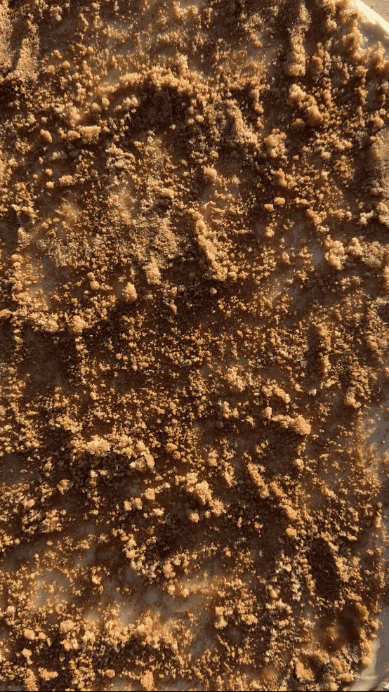 The butter and sugar spread out over the dough.