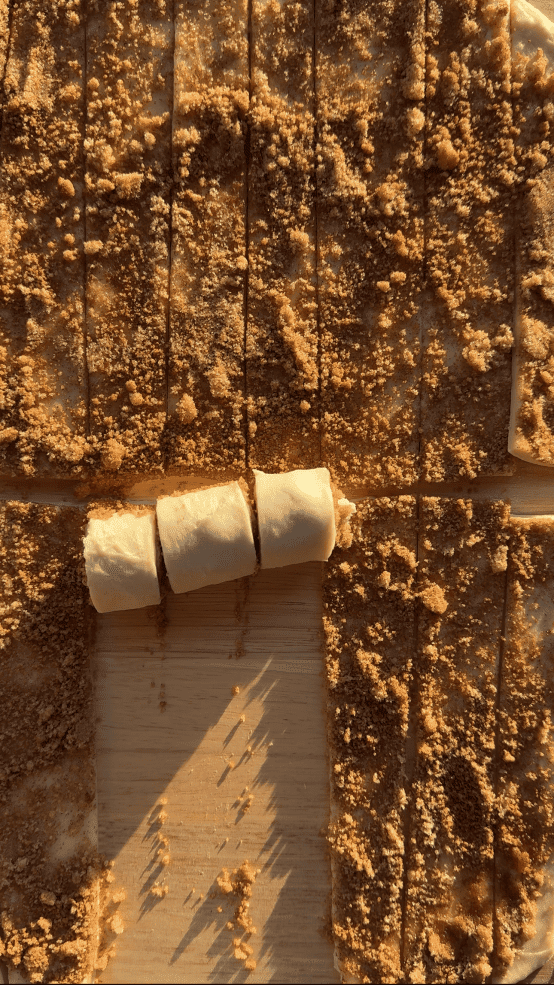 Rolling up the cinnamon roll dough.