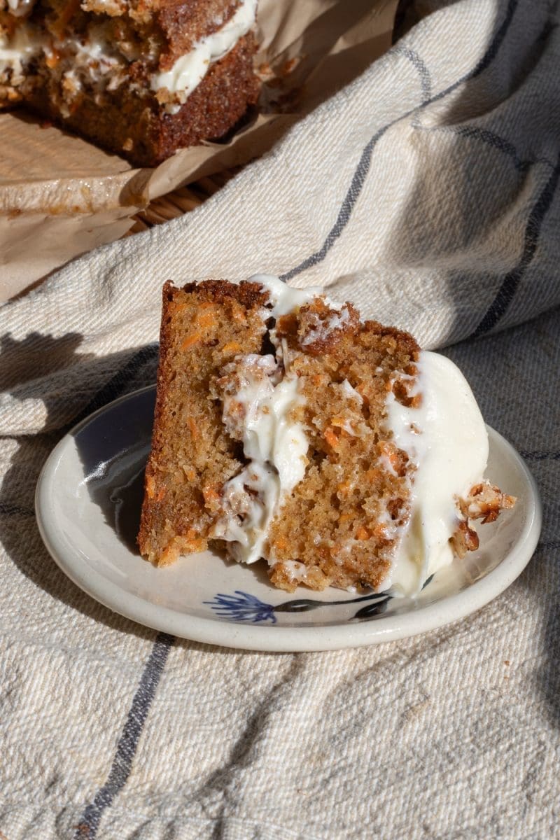 A slice of carrot cake with honey praline.