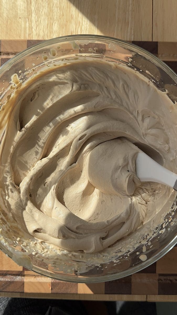 Mascarpone tiramisu cream in a mixing bowl.
