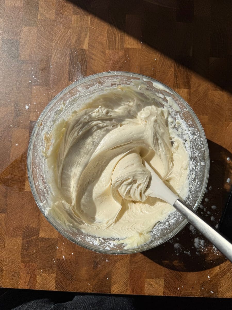Cream cheese frosting in a mixing bowl.