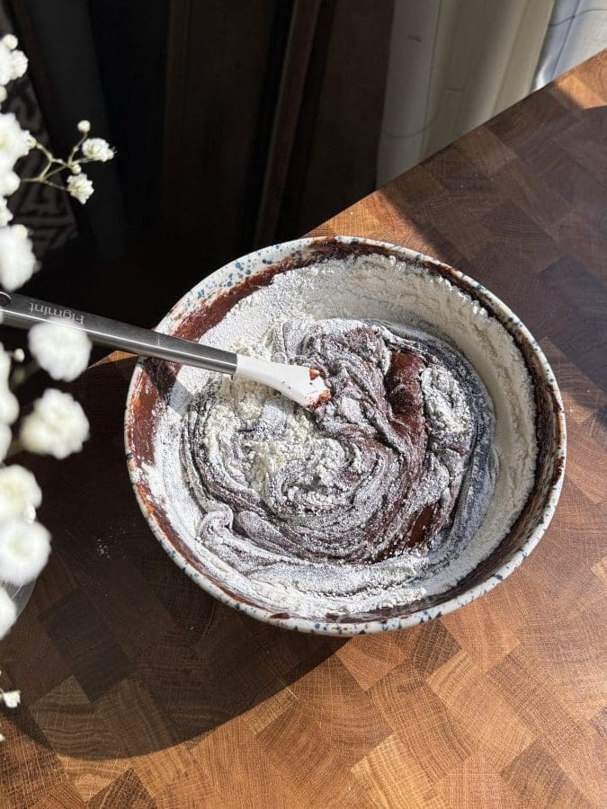 Dry ingredients being mixed into the wet ingredients.