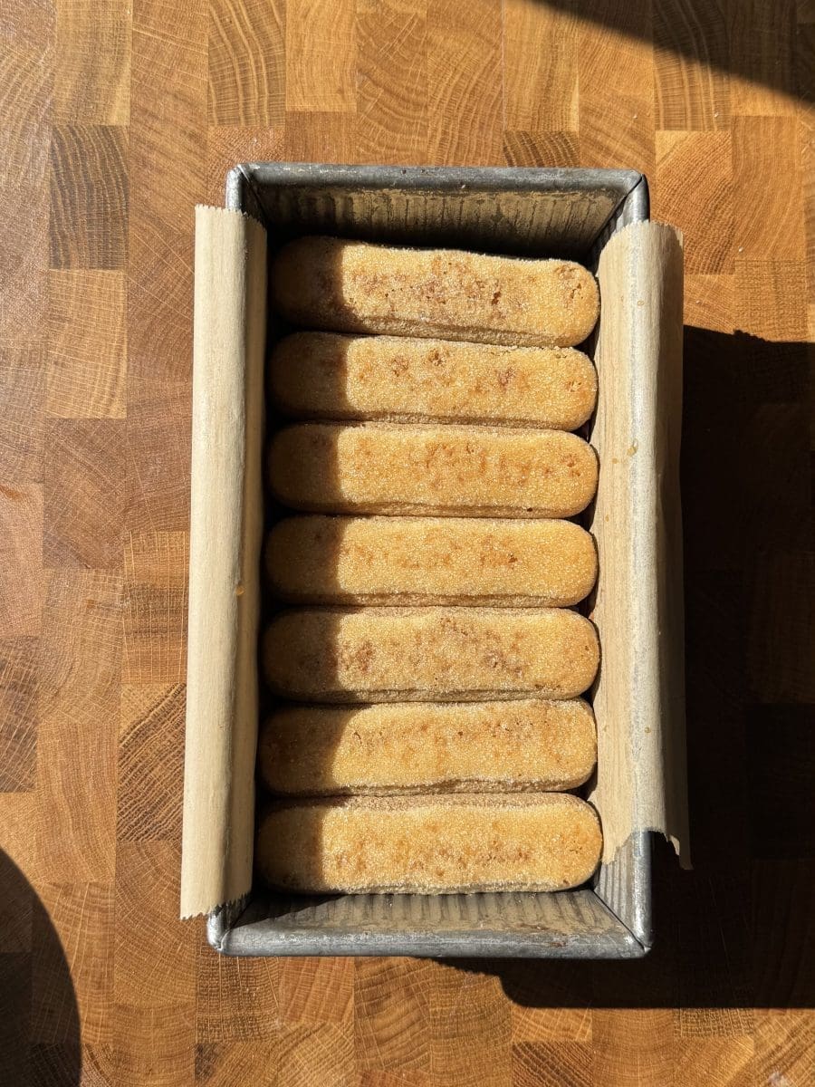 Espresso-soaked ladyfingers on top of the brownies.