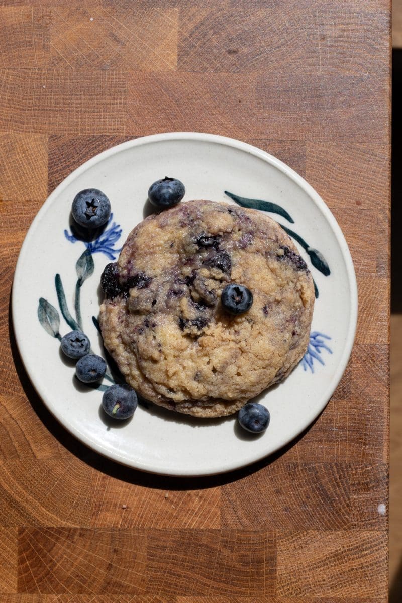 One of the blueberry muffin cookies on a small plate.