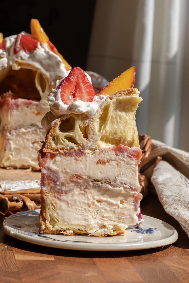 Close up of a slice of the strawberry peach ice cream cake.