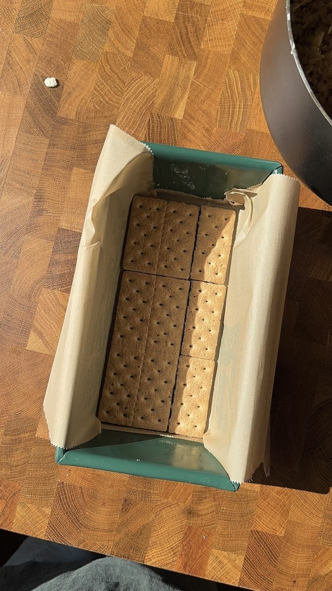 Graham crackers on the bottom of a loaf pan.