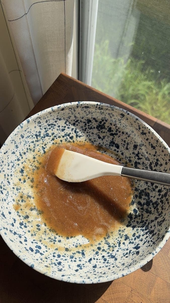 Wet ingredients mixed together in a mixing bowl.