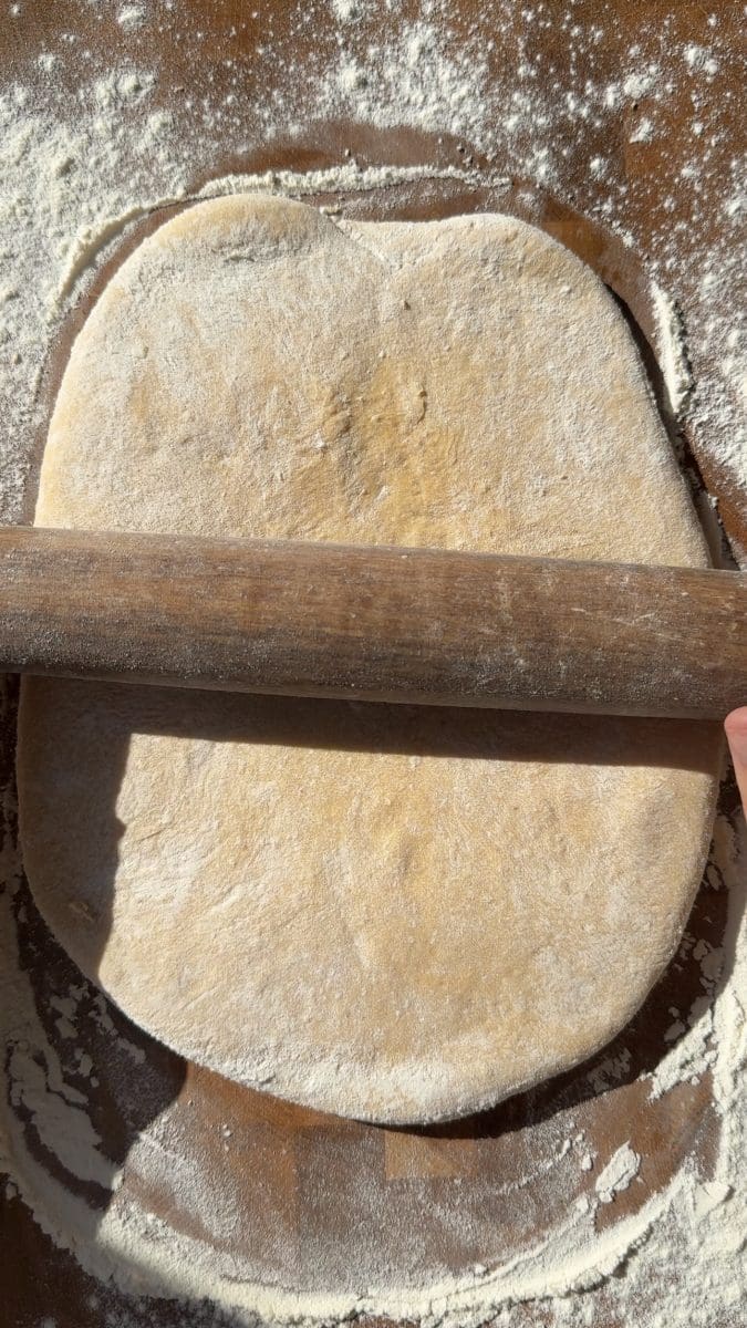 Rolling out the pumpkin dough.
