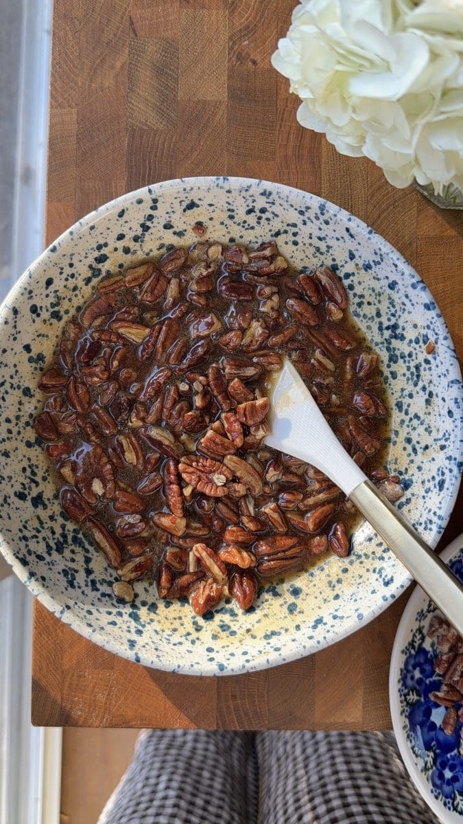 The maple pecan pie filling in a mixing bowl.