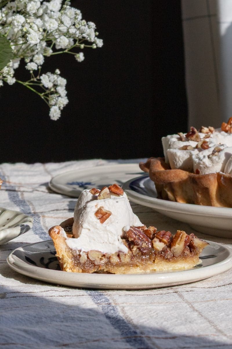 Close up of a slice of maple pecan pie.
