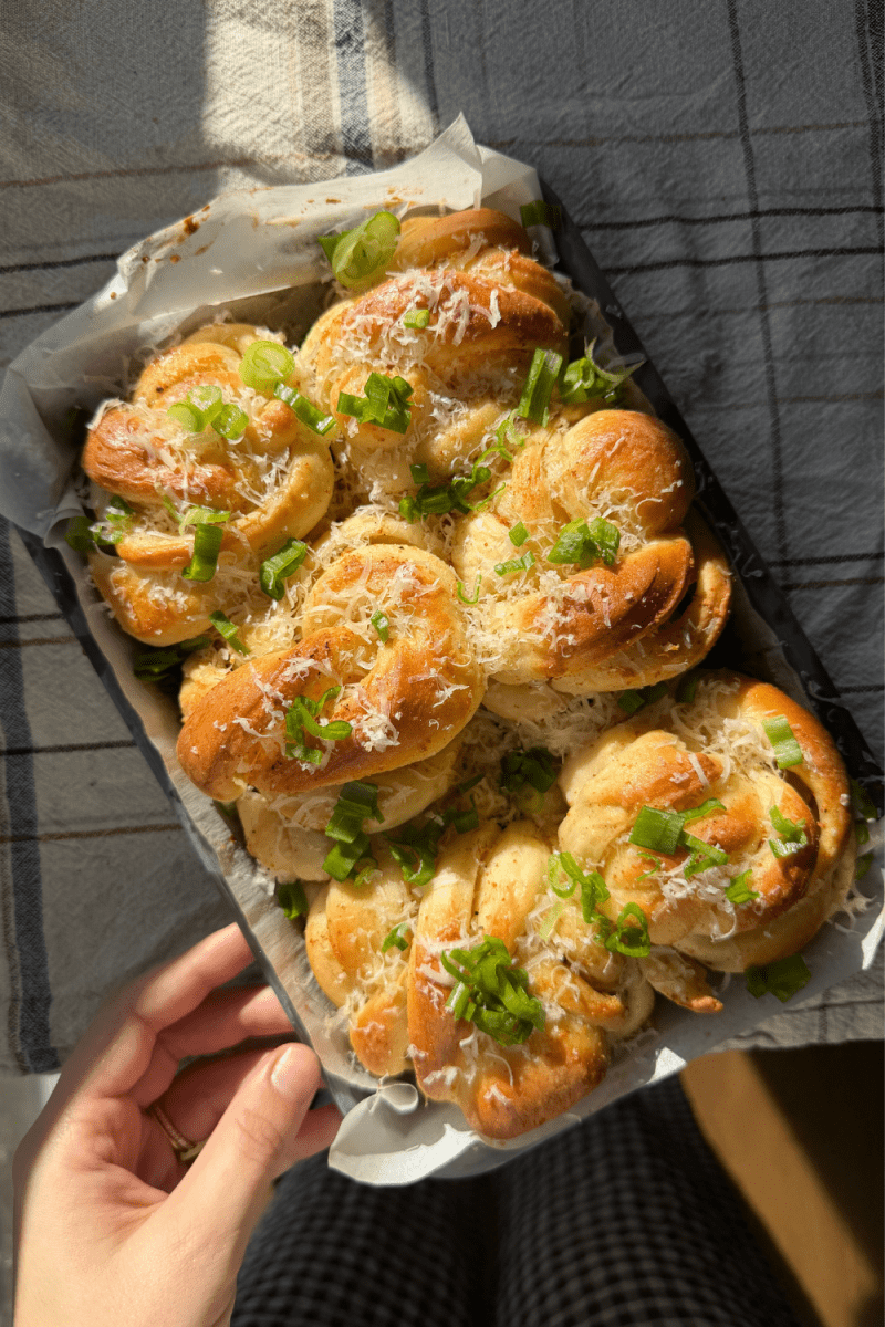The brown butter garlic knots in a tray.