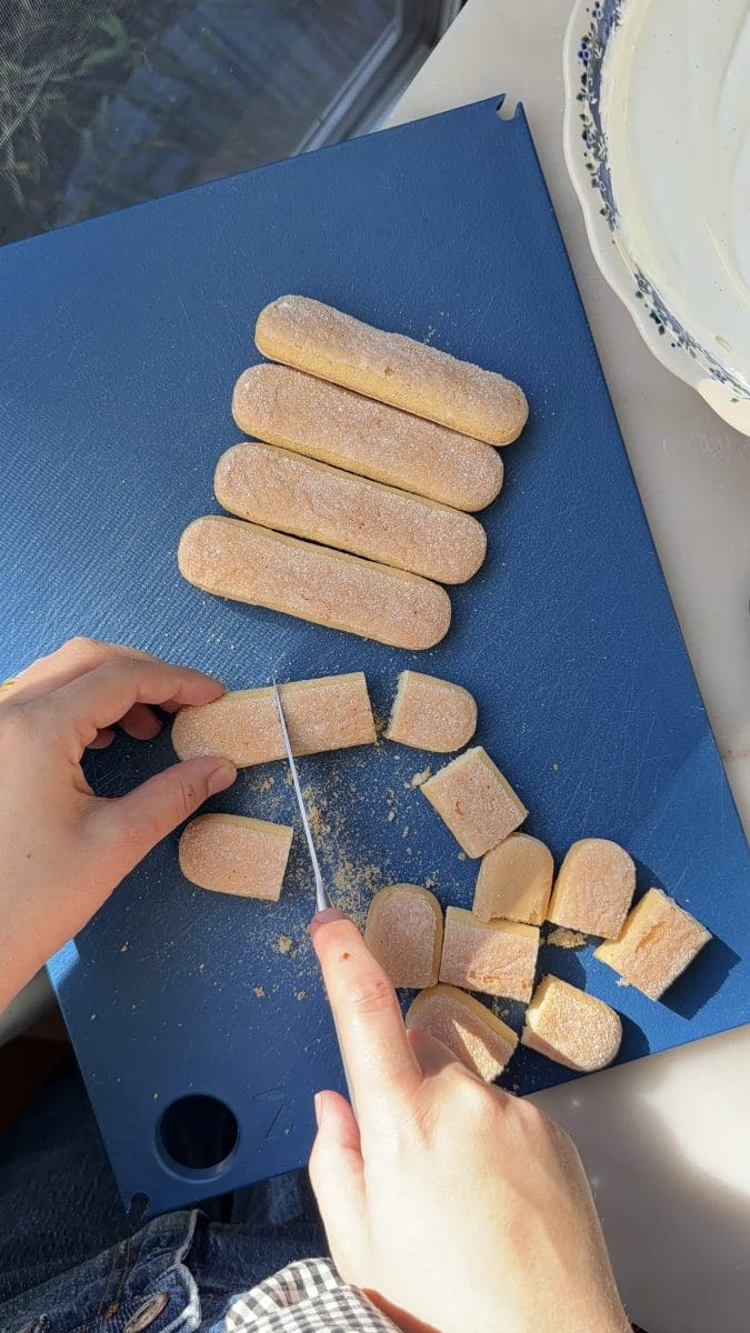 Cutting the ladyfingers.