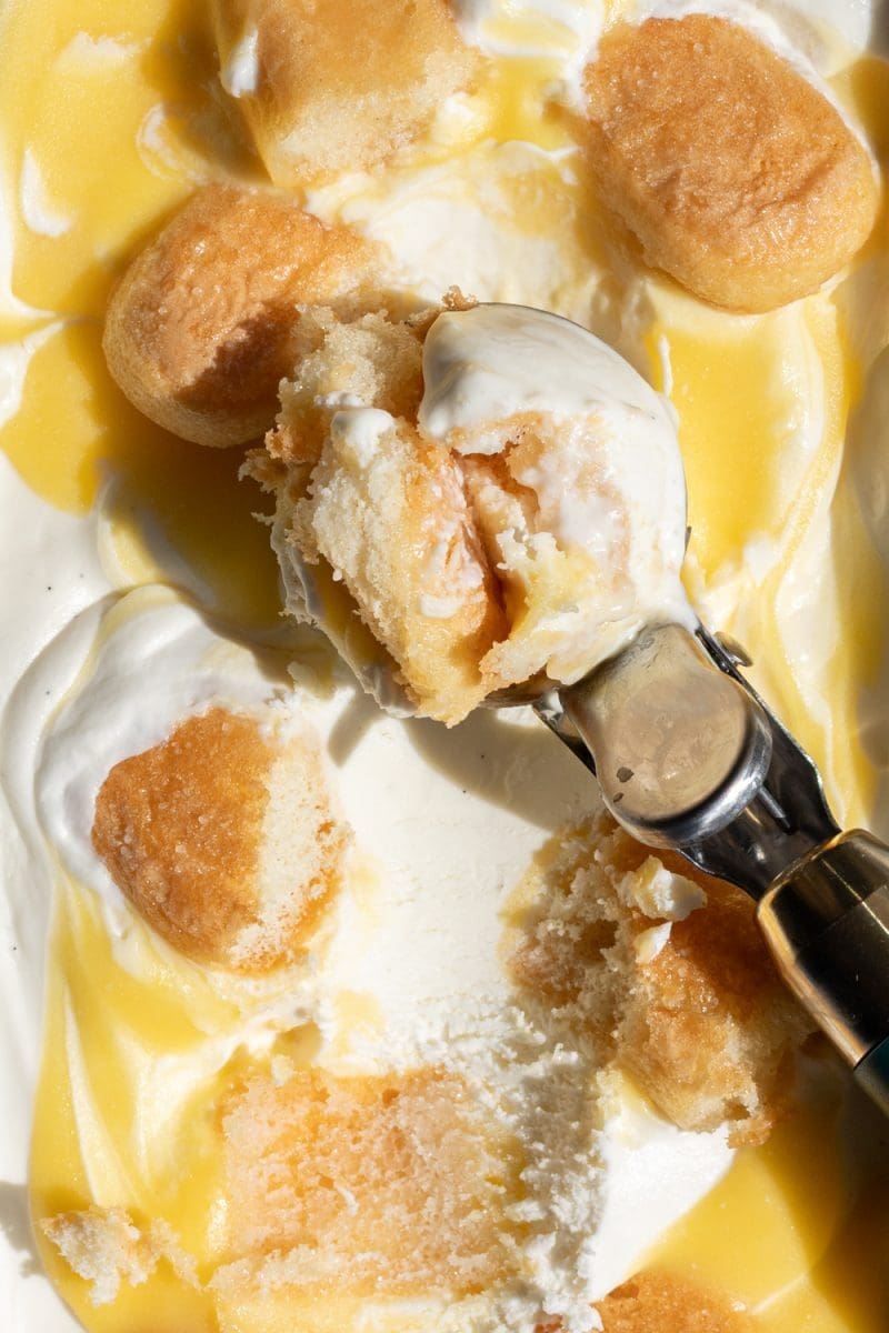Close-up of the no-churn lemon tiramisu ice cream with a scoop on top.
