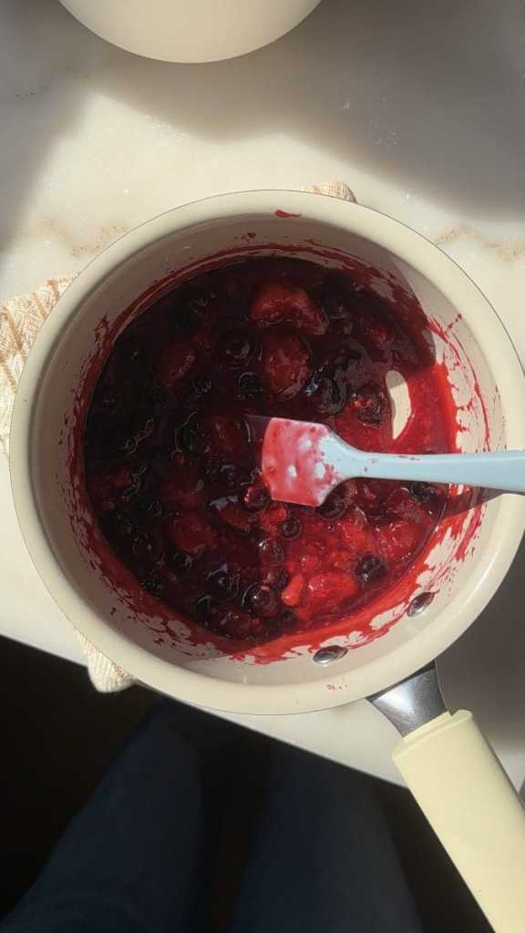 Mixed berry compote in a saucepan