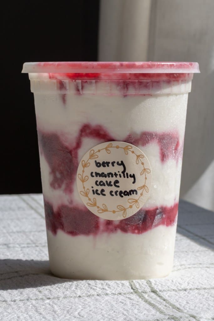 Berry chantilly cake ice cream in a deli container